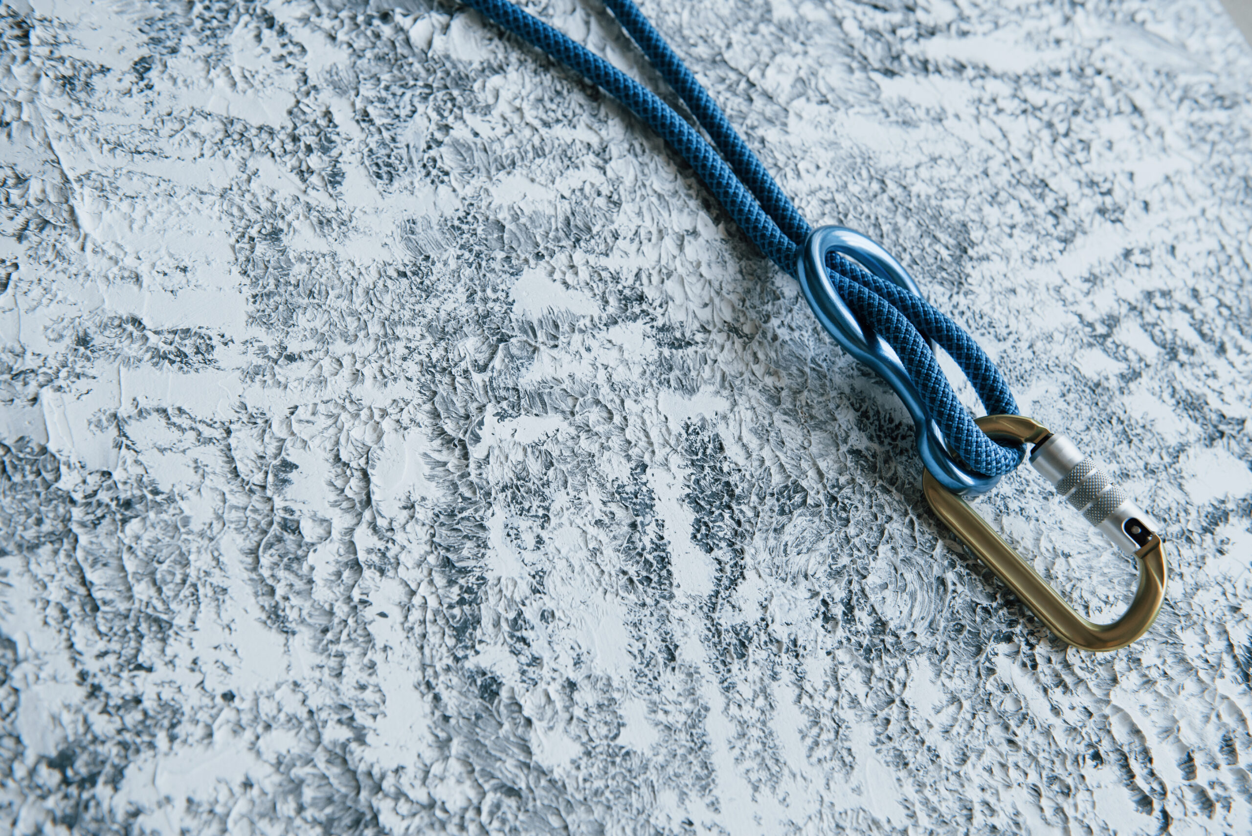 A close-up photo of a single rope used for rappelling, highlighting the wear and tear that can occur and emphasizing the importance of careful inspection and maintenance to prevent rope failure.